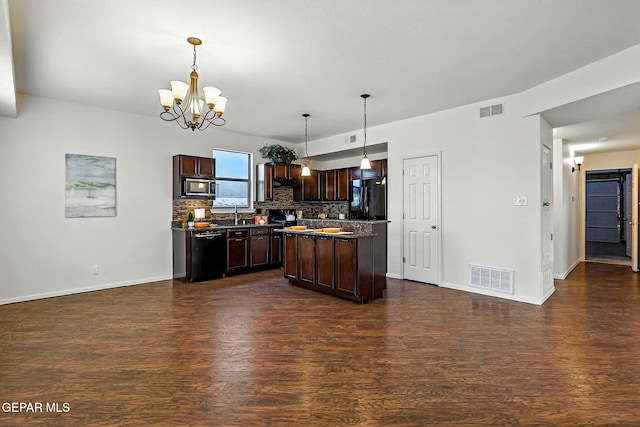 11353 W Ranch Ct, El Paso, TX 79934 - kitchen with black appliances, dark wood finished floors, dark brown cabinets, decorative backsplash, and a chandelier