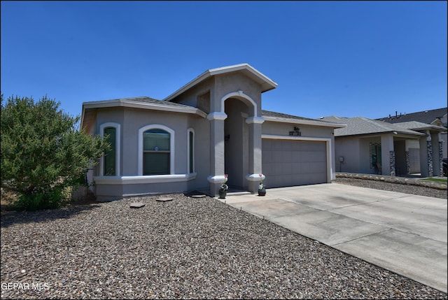 5949 Hidden Palms Dr, El Paso, TX 79924 - view of front of property with concrete driveway, an attached garage, and stucco siding