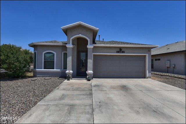 5949 Hidden Palms Dr, El Paso, TX 79924 - view of front of home with stucco siding, driveway, and an attached garage