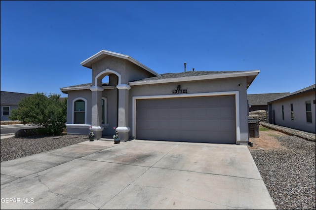 5949 Hidden Palms Dr, El Paso, TX 79924 - ranch-style house featuring stucco siding, concrete driveway, and a garage