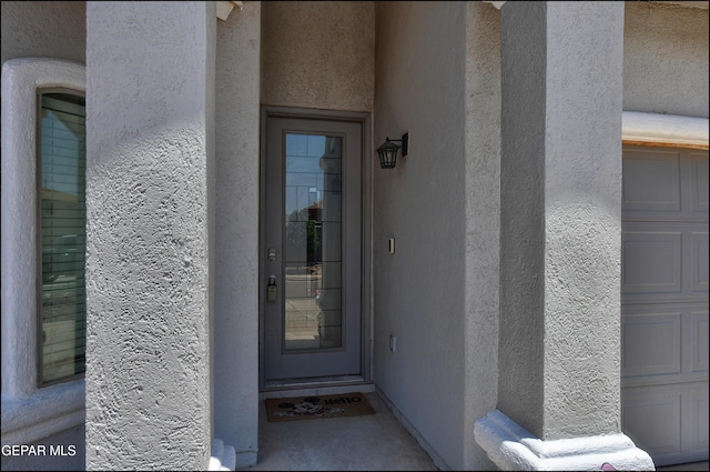 5949 Hidden Palms Dr, El Paso, TX 79924 - doorway to property with stucco siding