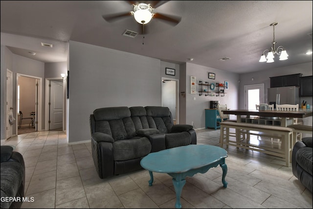 5949 Hidden Palms Dr, El Paso, TX 79924 - living room featuring a chandelier, ceiling fan, and light tile patterned floors