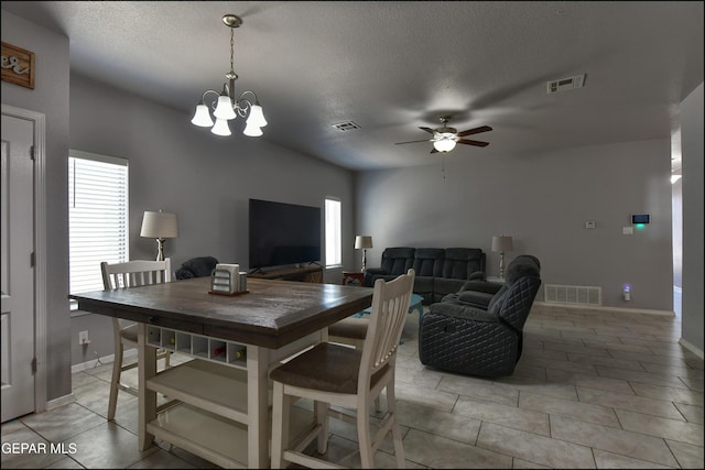 5949 Hidden Palms Dr, El Paso, TX 79924 - dining area featuring a ceiling fan, a textured ceiling, a chandelier, and light tile patterned floors