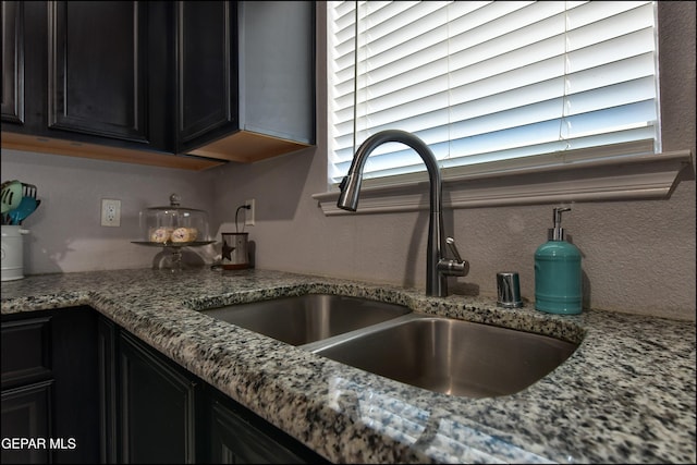 5949 Hidden Palms Dr, El Paso, TX 79924 - kitchen view of light stone counters and dark cabinetry