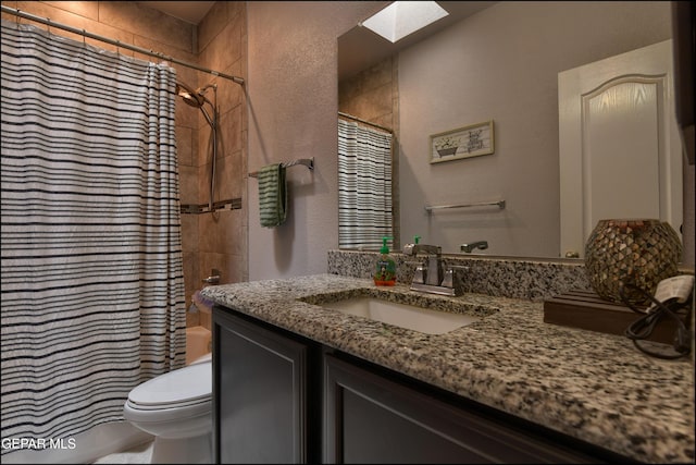 5949 Hidden Palms Dr, El Paso, TX 79924 - bathroom with a skylight, vanity, shower / tub combo, and a textured wall
