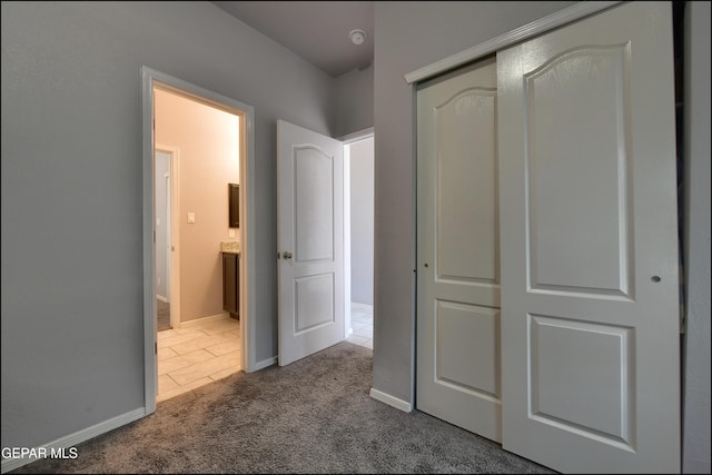 5949 Hidden Palms Dr, El Paso, TX 79924 - unfurnished bedroom featuring carpet flooring, a closet, and tile patterned floors