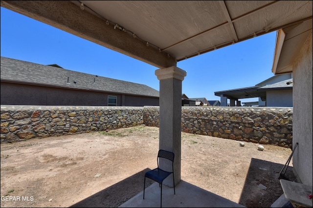 5949 Hidden Palms Dr, El Paso, TX 79924 - fenced backyard with a patio area