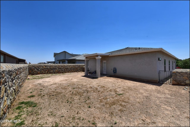 5949 Hidden Palms Dr, El Paso, TX 79924 - rear view of property with stucco siding