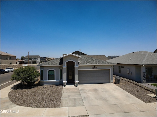 5949 Hidden Palms Dr, El Paso, TX 79924 - ranch-style house with a garage, stucco siding, concrete driveway, and a shingled roof