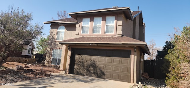 7342 Luz De Villa Ct, El Paso, TX 79912 - view of front of property with stucco siding, an attached garage, roof with shingles, and concrete driveway