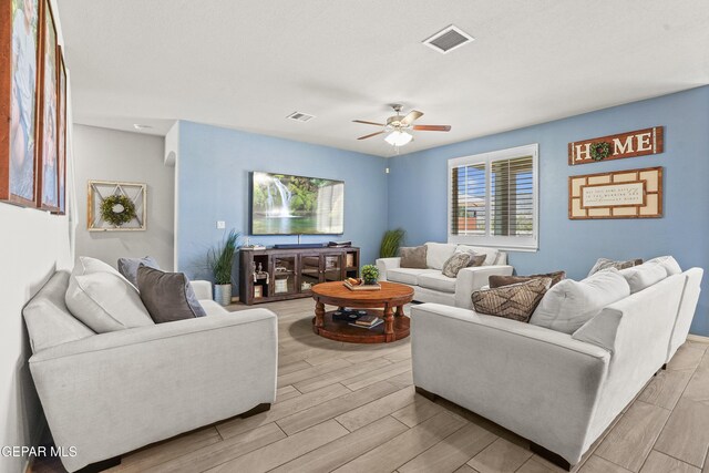 2228 Thawline Pl, El Paso, TX 79911 - living area featuring a ceiling fan and light wood-style flooring