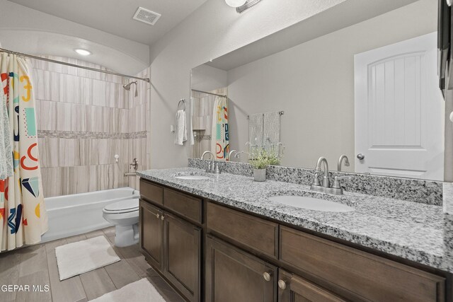 2228 Thawline Pl, El Paso, TX 79911 - full bath featuring double vanity, shower / bath combo with shower curtain, and tile patterned flooring
