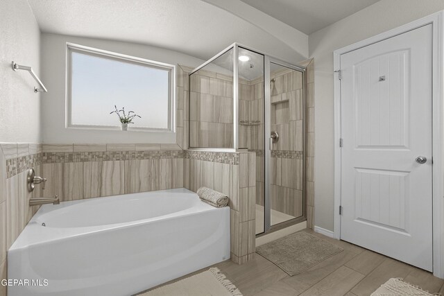 2228 Thawline Pl, El Paso, TX 79911 - bathroom featuring a garden tub and a stall shower