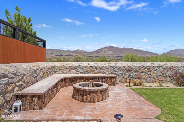 2228 Thawline Pl, El Paso, TX 79911 - view of patio with an outdoor fire pit and a mountain view