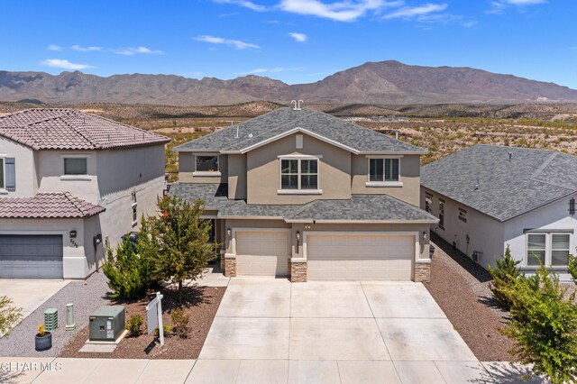 2228 Thawline Pl, El Paso, TX 79911 - view of front of property featuring driveway, stucco siding, stone siding, and a mountain view