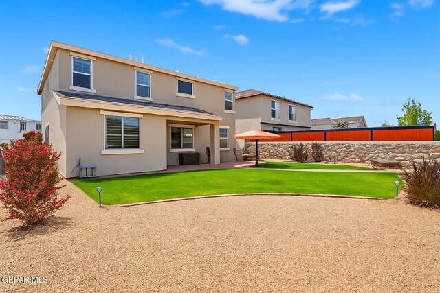 2228 Thawline Pl, El Paso, TX 79911 - rear view of house featuring stucco siding and a patio area