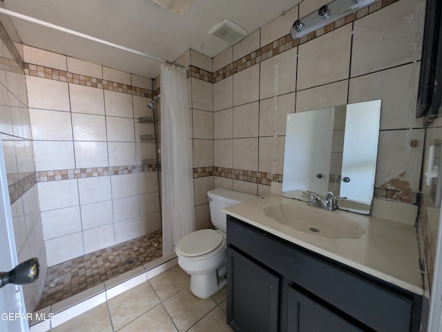 11828 Tracy Austin Ln, El Paso, TX 79936 - full bath featuring tile patterned flooring, vanity, tile walls, and a tile shower