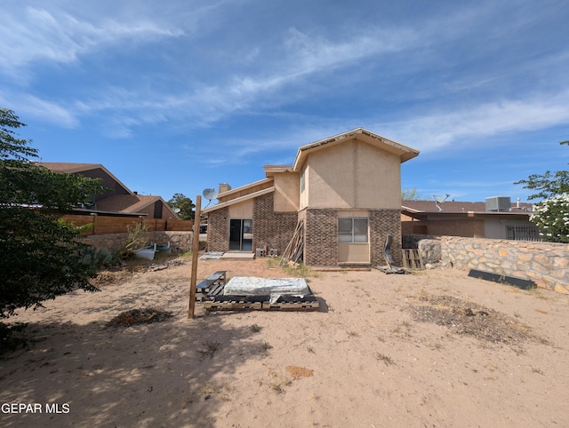 11828 Tracy Austin Ln, El Paso, TX 79936 - rear view of property with stucco siding