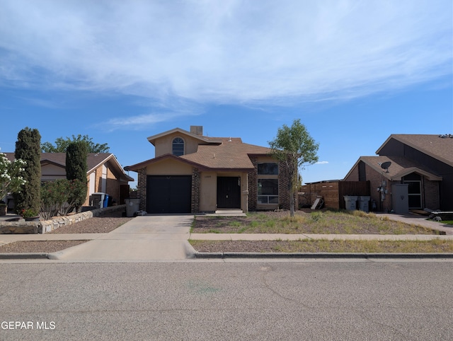 11828 Tracy Austin Ln, El Paso, TX 79936 - traditional home featuring driveway, brick siding, and a garage