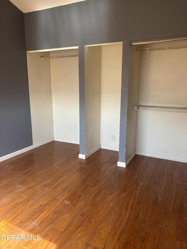 11828 Tracy Austin Ln, El Paso, TX 79936 - unfurnished bedroom with wood finished floors and a closet