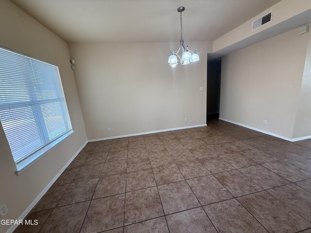 11025 Acoma St, El Paso, TX 79934 - tiled spare room with a chandelier and baseboards