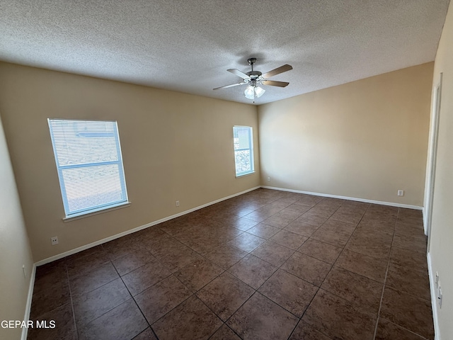 11025 Acoma St, El Paso, TX 79934 - tiled spare room featuring a ceiling fan and a textured ceiling