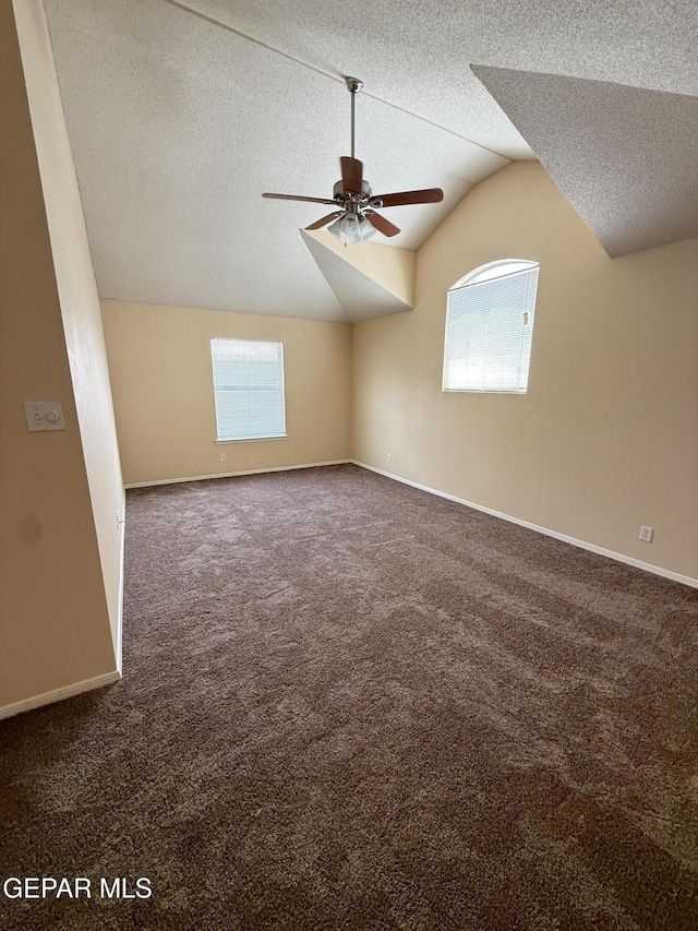 11025 Acoma St, El Paso, TX 79934 - additional living space featuring a textured ceiling, a ceiling fan, carpet flooring, healthy amount of natural light, and vaulted ceiling