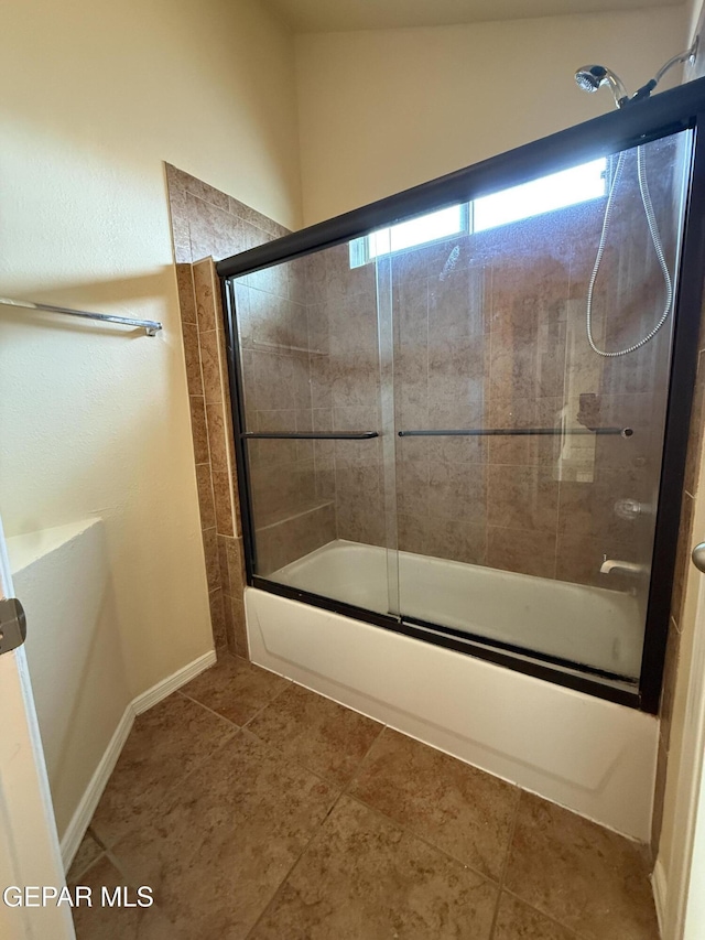 11025 Acoma St, El Paso, TX 79934 - full bath featuring combined bath / shower with glass door and tile patterned flooring