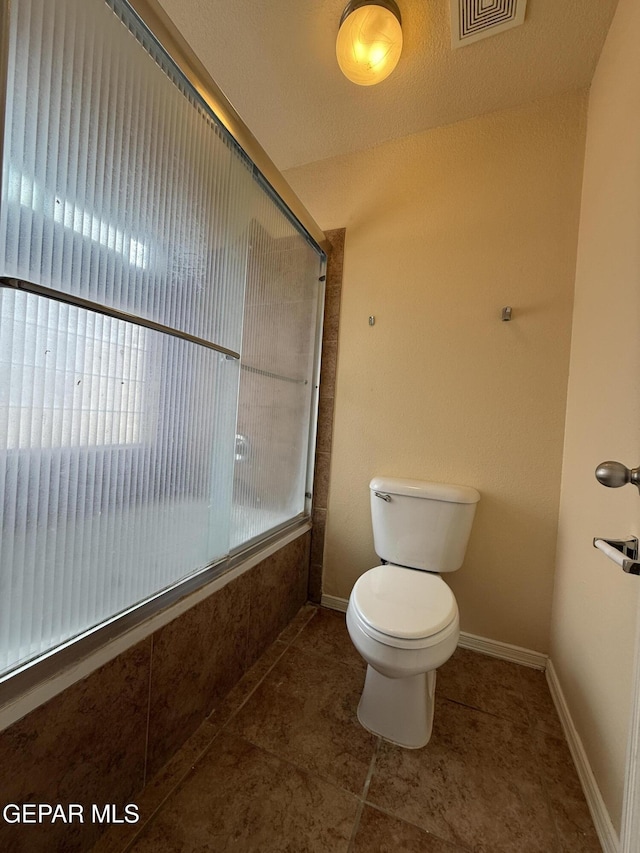 11025 Acoma St, El Paso, TX 79934 - full bath featuring tile patterned flooring and combined bath / shower with glass door