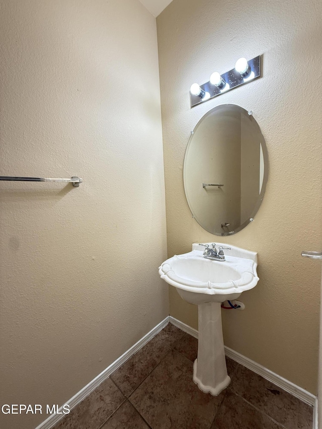 11025 Acoma St, El Paso, TX 79934 - bathroom featuring tile patterned floors and baseboards