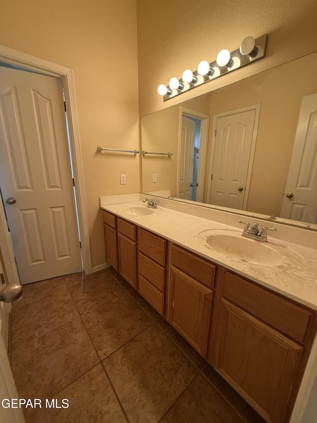 11025 Acoma St, El Paso, TX 79934 - bathroom with double vanity and tile patterned floors