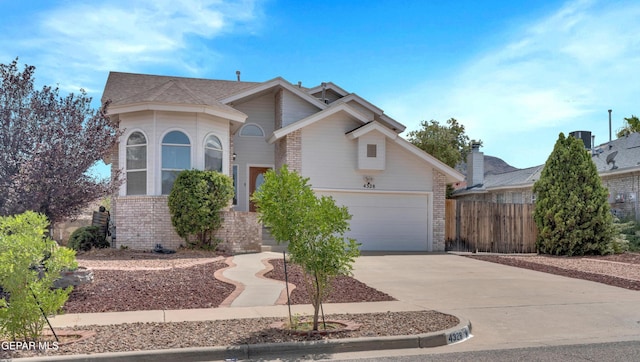 4328 Loma Alegre Dr, El Paso, TX 79934 - view of front of house with brick siding, concrete driveway, and a garage