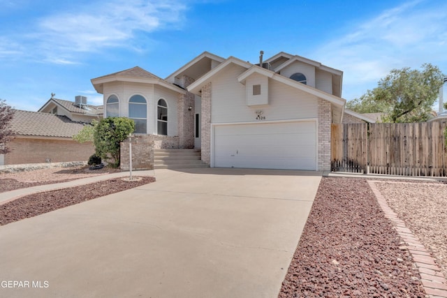 4328 Loma Alegre Dr, El Paso, TX 79934 - view of front of property featuring brick siding, driveway, and a garage