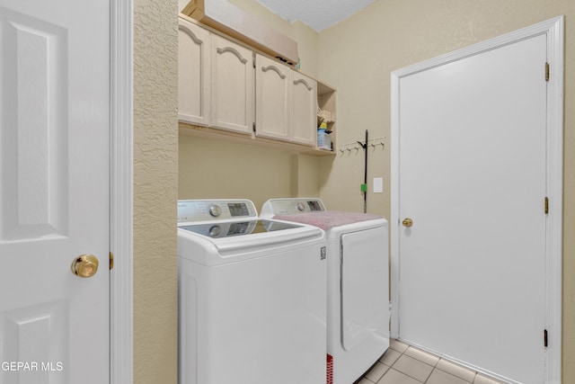 4328 Loma Alegre Dr, El Paso, TX 79934 - laundry room with cabinet space, washer and dryer, and light tile patterned floors