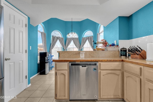 4328 Loma Alegre Dr, El Paso, TX 79934 - kitchen with dishwasher, a peninsula, light tile patterned floors, light countertops, and hanging light fixtures