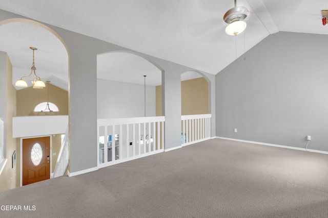 4328 Loma Alegre Dr, El Paso, TX 79934 - carpeted empty room featuring lofted ceiling, ceiling fan, and arched walkways
