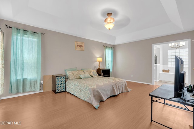 4328 Loma Alegre Dr, El Paso, TX 79934 - bedroom with a raised ceiling, a chandelier, and wood finished floors