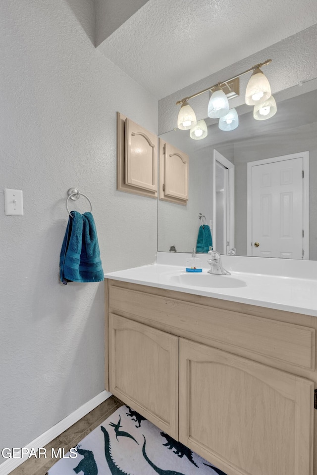 4328 Loma Alegre Dr, El Paso, TX 79934 - bathroom featuring vanity, a textured ceiling, and a textured wall