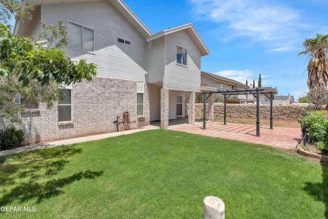 4328 Loma Alegre Dr, El Paso, TX 79934 - back of house with a pergola, a patio area, a lawn, and brick siding