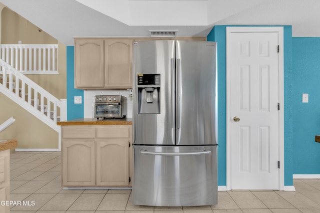 4328 Loma Alegre Dr, El Paso, TX 79934 - kitchen featuring stainless steel fridge, light tile patterned flooring, and light brown cabinetry