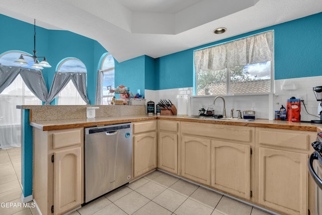 4328 Loma Alegre Dr, El Paso, TX 79934 - kitchen featuring dishwasher, light tile patterned flooring, a peninsula, and healthy amount of natural light