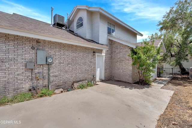 4328 Loma Alegre Dr, El Paso, TX 79934 - back of property featuring a patio area, brick siding, and a shingled roof