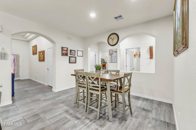 237 Gonzalo Cir, El Paso, TX 79932 - dining room with arched walkways, wood finished floors, and recessed lighting