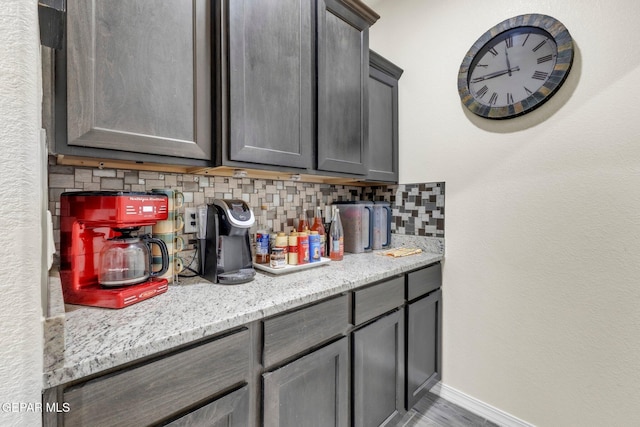 237 Gonzalo Cir, El Paso, TX 79932 - bar area with decorative backsplash and wood finished floors