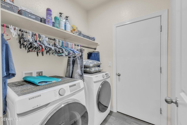 237 Gonzalo Cir, El Paso, TX 79932 - laundry area featuring separate washer and dryer and light wood-style floors