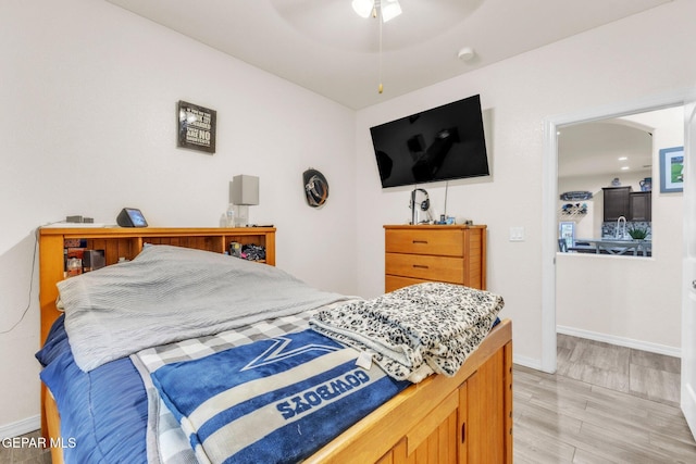 237 Gonzalo Cir, El Paso, TX 79932 - bedroom with arched walkways, ceiling fan, and light wood-style floors