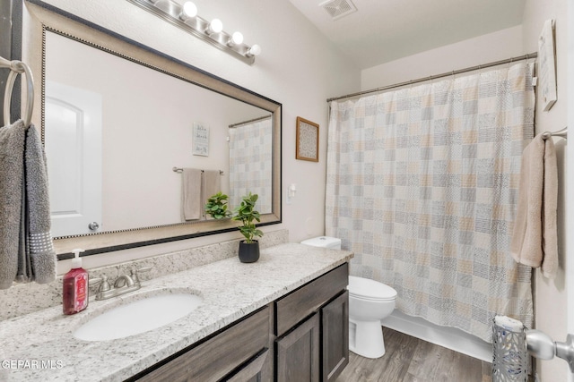 237 Gonzalo Cir, El Paso, TX 79932 - bathroom with vanity, wood finished floors, and curtained shower