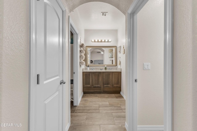 237 Gonzalo Cir, El Paso, TX 79932 - bathroom with vanity and a textured wall