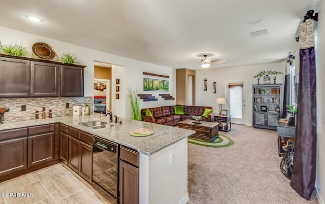15249 Apex Ct, El Paso, TX 79938 - kitchen with dishwasher, a peninsula, open floor plan, light stone counters, and decorative backsplash