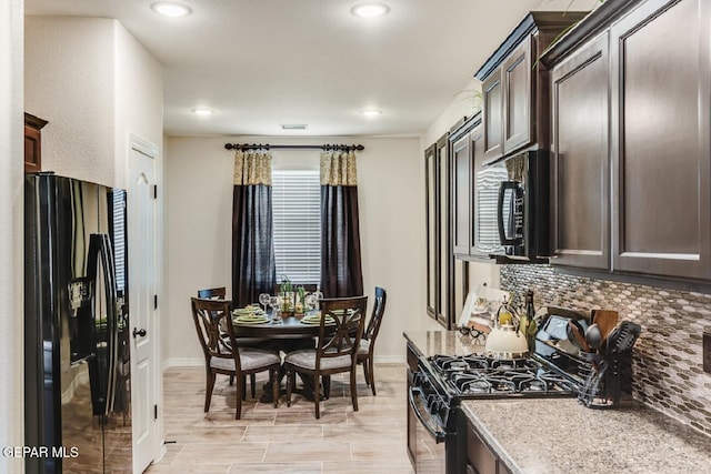 15249 Apex Ct, El Paso, TX 79938 - kitchen with black refrigerator with ice dispenser, range with gas cooktop, tasteful backsplash, dark brown cabinetry, and recessed lighting